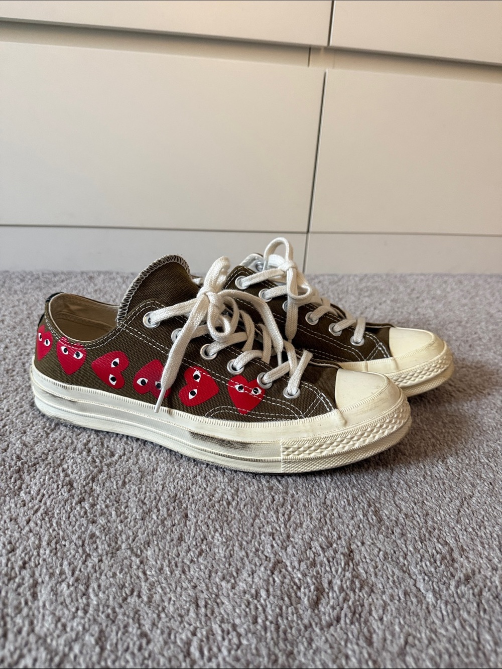 Comme Des Garcons Play Olive Low Top Converses with Red Heart Motif